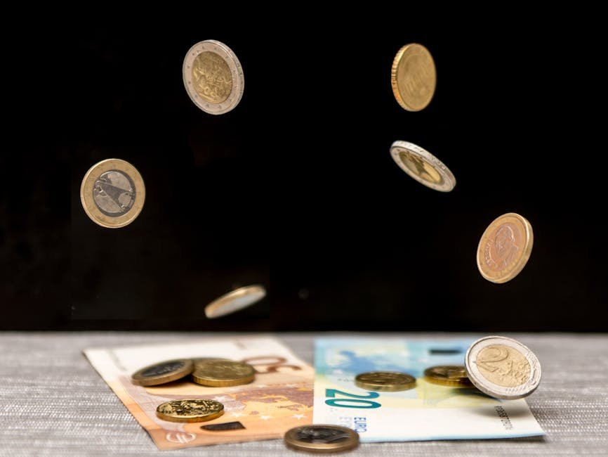 Dynamic image of euro coins and banknotes cascading onto a table against a black background.